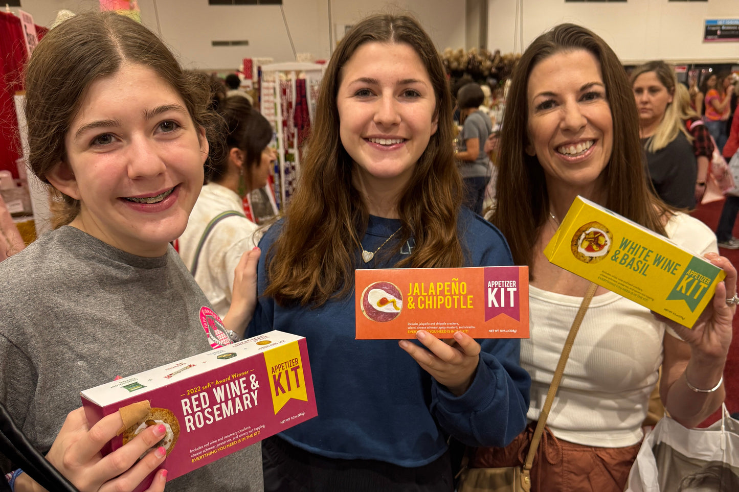 Crackerology kits in three womens hands